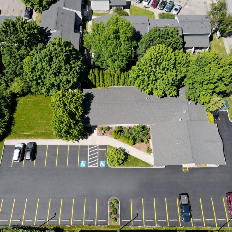 Completed asphalt parking lot with fresh striping at Loftus Family Dental in Coeur d'Alene.