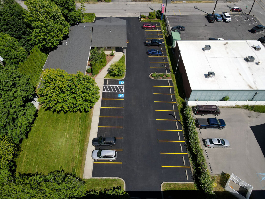 Drone view of completed parking lot replacement and striping at Loftus Family Dental in Coeur d'Alene, Idaho.