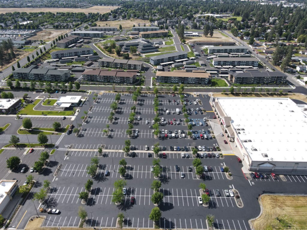 WinCo Foods Commercial Parking Lot Maintenance Aerial view of WinCo Foods commercial parking lot after asphalt patching, sealcoating and striping.